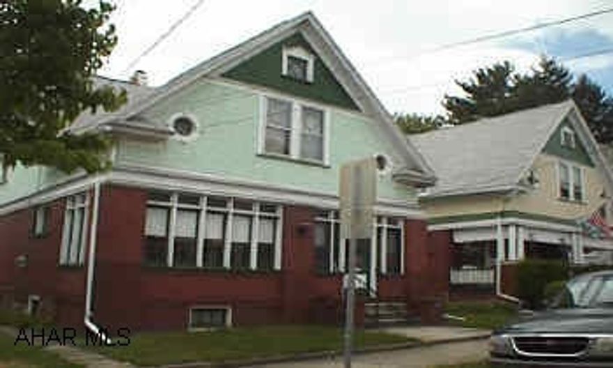 40x200 lot.  Brick home with sunroom, hardwood floors, natural woodwork, pocket door and all appliances.