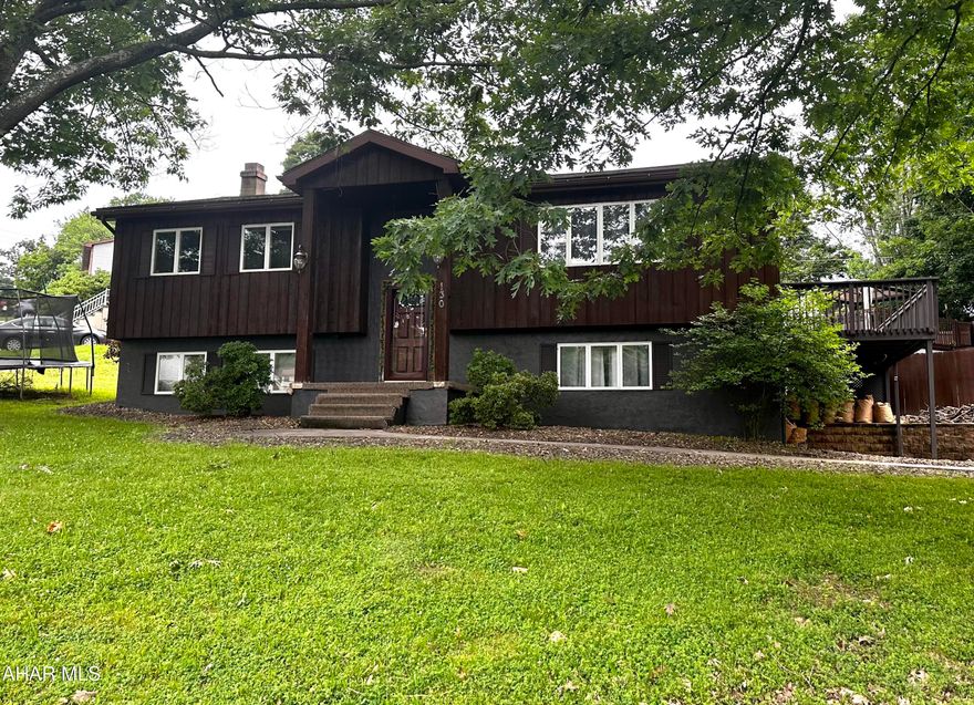 Welcome to this charming cedar bi-level home ideally located on the corner of four city lots. This home offers an ideal setting for entertaining! Inside, you'll be greeted by a warm and inviting living room with a stunning cathedral ceiling. The living area seamlessly leads into a spacious open kitchen and dining room. Step into the backyard, where you'll find a refreshing pool and a relaxing hot tub and expansive wrap-around deck. In the finished lower level, you'll discover a bonus area that can be transformed into a home office or an additional bedroom. Interior pictures will be coming soon, and the property is being sold as is. Don't overlook its incredible potential! With a little TLC, this property can become your dream home.