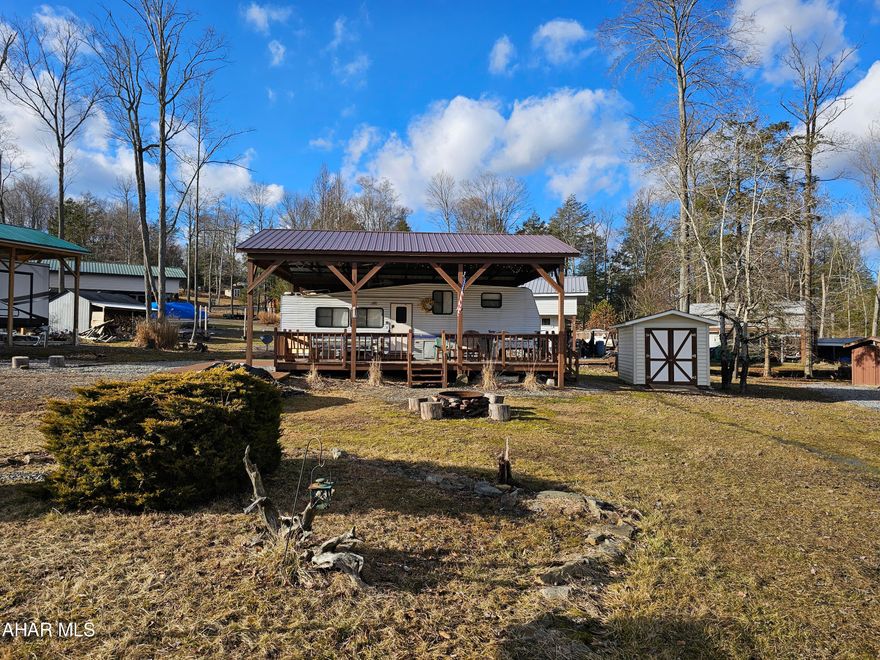 Classic 1995 5th wheel 35' camper on 2 lots inside Glendale Yearound. Plenty of room to park your vehicle or your boat. There is a shed included with the option to add another shed. Camper is in good condition and everything is in working order. A pavilion protects the camper and the large deck thats attached. Great lots and location. 
Glendale Yearound is a gated community located minutes from Glendale Lake and Prince Gallitzin State Park. Community pool, basketball, tennis, dog park, security, etc.