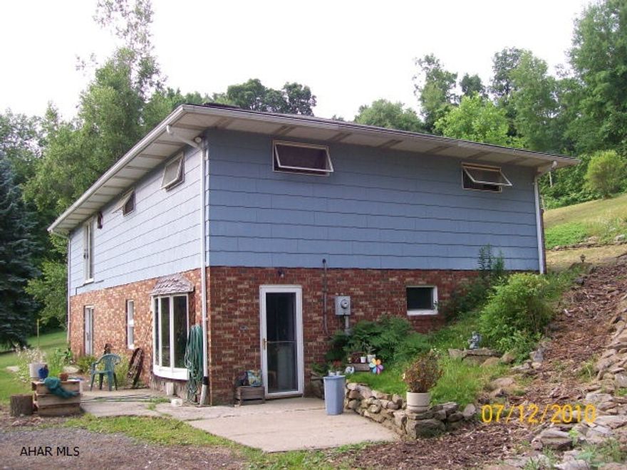 55 acres.  Survey available.  Barn, outbuildings, stocked ponds.  approx. 15 acres open, 40 wooded.  Very private.  Great for horses and hunting.