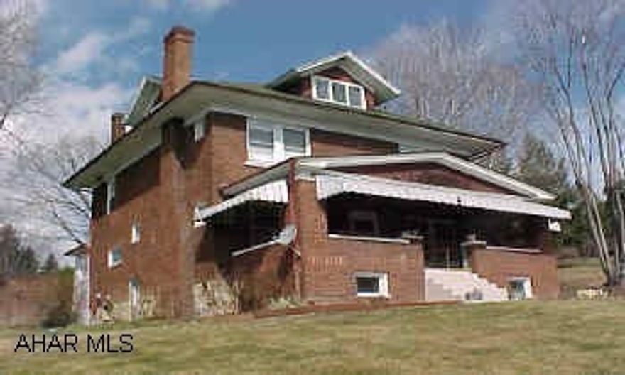 Very large brick home with four bedrooms and finished attic.  Functional fireplace.  Built in bookselves and dining room hutch.  Huge lot!  Call office for apt.