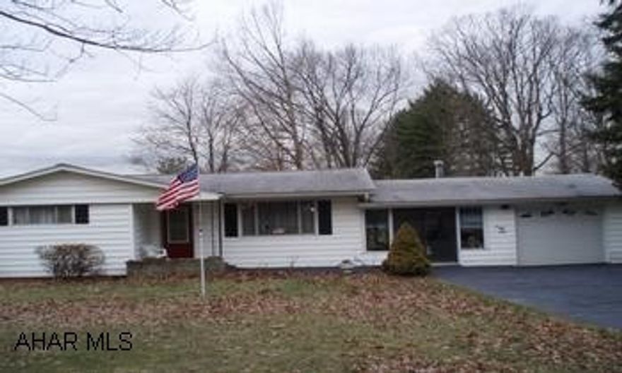 Rancher with garage, breezeway on large level lot.