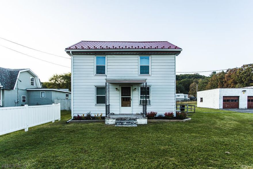 Great 3 bedroom, 1 bath house with a LARGE yard and LARGE 3 car garage. Beautiful hardwood floors and eating area in kitchen.