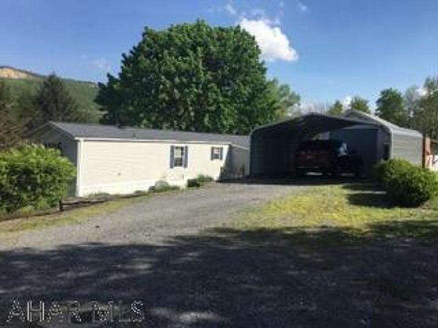 Prestigious 2 Bedroom 2 Bath Mobile Home on over 3/4 of an acre of land.  Interior renovated with old world charm, wormy barn siding, stone fireplace, waterproof vinyl plank flooring, stunning interior throughout, all new Pex plumbing, new AC unit, newer hotwater tank and shingle roof.  Additional deeded lot has city water/sewer taps for endless possibilities.  Very private setting.  This is a must see property - won't last long!