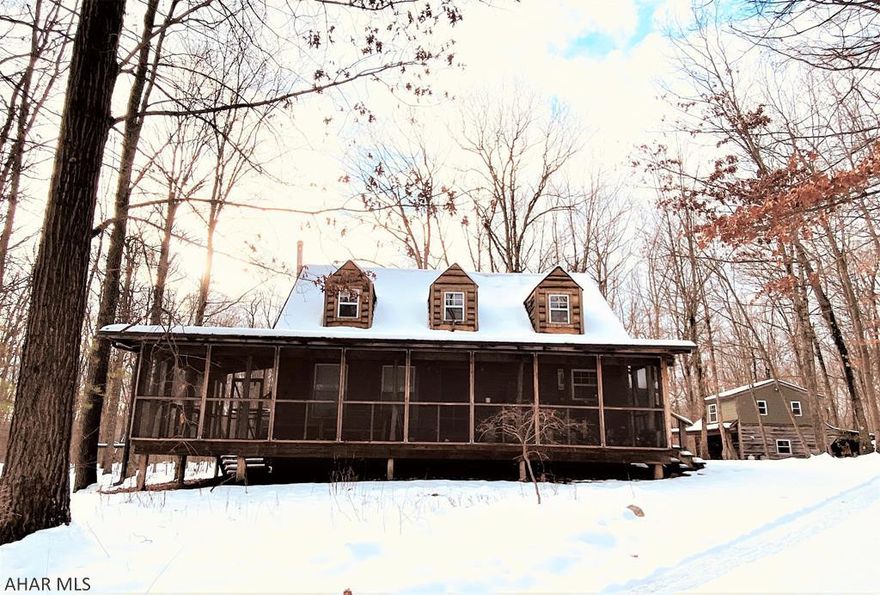 Abundantly private home located on a large wooded lot.  House features all of the amenities needed for full time residence and all of the space for recreational pursuits.  A lengthy front porch gives a pleasurable place to enjoy the property.  Main house is 2 bed; 1.5bath; Guest house has an additional 1 bed and 1 bath.  Plenty of flat space for expansion with mature timber throughout the property.  Guest house with carport adds additional living space with a living room and kitchenette and a upstairs bedroom and full bath for more accommodations.  Property is easily accessed from local highways and one can quickly be back to town or other locales.