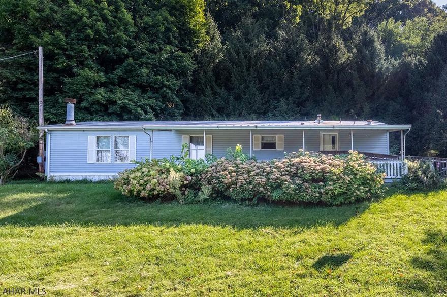 Perfect spot for Nature lovers - located in wooded surroundings but minutes away from downtown Bedford.  Home has been vacant and will need some TLC, location is great.  Large shed with electric is included.