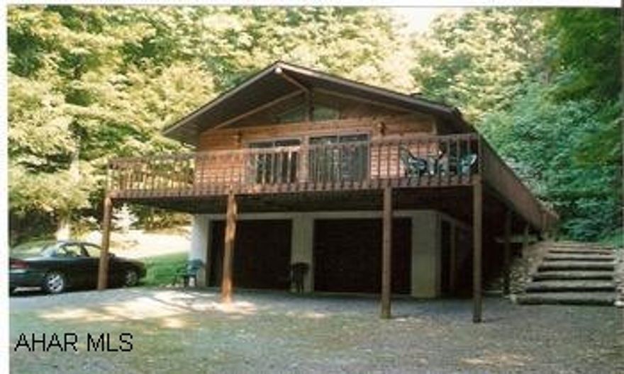 Lovely one-owner home situated on 59.59 wooded acres in a great mountain setting. Secluded property makes for a great vacation or "getaway" home. Large wraparound deck offers beautiful mountain views.