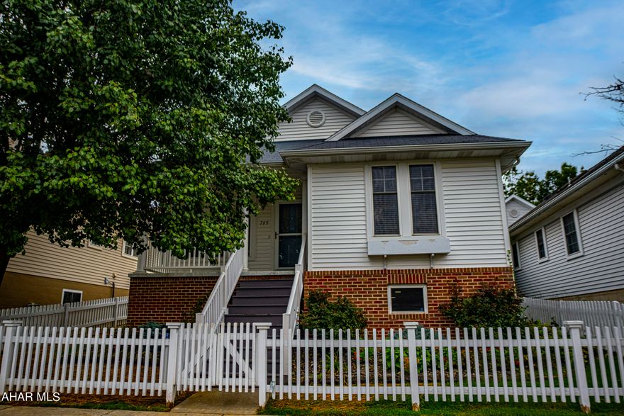 Beautiful cottage located in the desirable Holliday Hills development. This house offers an open concept with 2 BR 2BA.  The basement is finished for additional living space. Also, 2 additional parking spaces beside the garage. **NEW LOWER PRICE!!