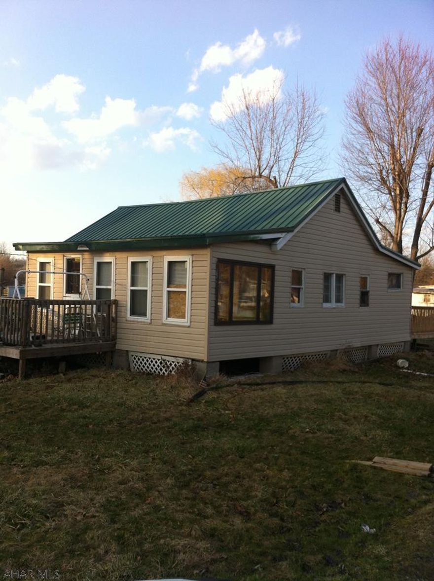 COTTAGE IN CAMP SUNSHINE,  NEEDS  TLC OR COULD BE TORN DOWN AND MADE A GREAT LOT TO BUILD ON , WATER AND SEWER HOOK UPS AVAL.