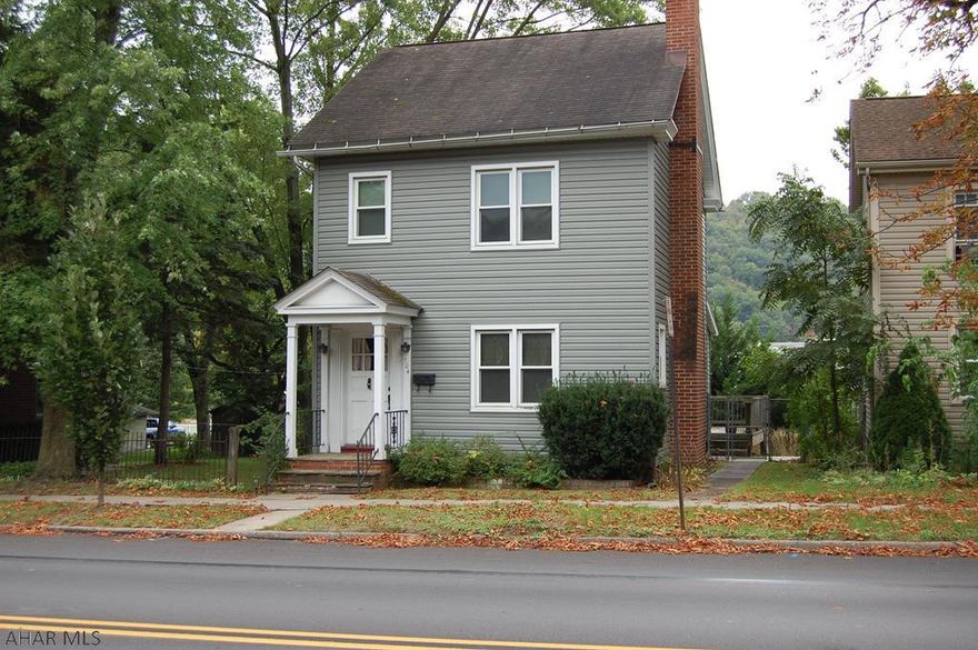 Lovely 2 bedroom, 1 bathroom home in the heart of Hollidaysburg Borough.  Hardwood floors throughout the home with gas fireplace in the Living Room.  Attic has plenty of storage space, which could be finished.  Fenced in yard with oversized 2 car detached garage, plenty of off-street parking available.  New sidewalks outside leading to the garage and basement entrance.  Many updates throughout..