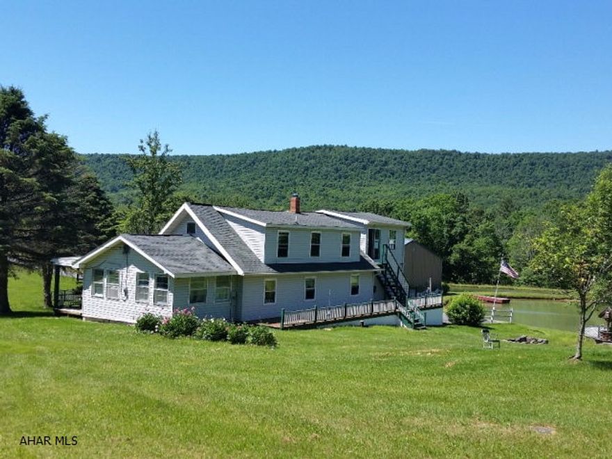 Here's YOUR OPPORTUNITY for peace and tranquility! 26 acres, 2 ponds, great views, 3 bedroom, 2 bath home, 3 1/2 story Bank Barn and 2 metal pole buildings & Shed with covered deck. Master bedroom suite has ladder type steps and outside separate entrance. Great place to raise livestock or horses. #J-339.