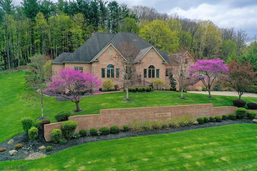 Impeccable quality, custom built, full brick home. Stunning property w/ brilliant views resting atop Bedford Borough. Main level has a grand double door foyer; LR w/ built-ins & FP; kit w/ custom cherry cabinetry & granite; sitting room; DR; master suite w/ morning bar & bath; 2 additional bedrooms w/ full baths; huge laundry/mud rm; butler's pantry & half bath. 2nd level w/ full suite; a LR; kit; bedroom; & full bath. Walk-out basement w/ rec room & FP; bedroom; & half bath; in-law suite w/ kitchen & dining area; bedroom & full bath. Double concrete driveway & finished 4-car garage. Natural gas heating system w/ C/A; 400-amp electric; security; & intercom system. 12' ceilings; hardwood & tile floors; crown moldings; & custom trim throughout. An absolutely striking & breathtaking home!!