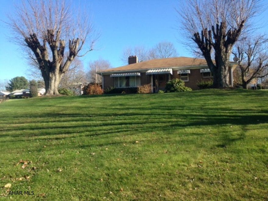 Brick home on a corner lot on the Summit in Everett. Three bedroom, 1.5 bath in move-in ready condition. Lovely brick fireplace in carpeted living room (hardwoods under carpet). Hardwood floors in bedrooms. Tile bath. Spacious kitchen and first floor laundry room. Attached 2 car garage. Basement with brick fireplace ready to be finished for additional living space. 200 amp electric panel with a 100 amp subpanel, hot water oil heat, separate heat pump and central air. New hot water heater. New fuel tank. Nice home in a nice area. Ready to make it your own!