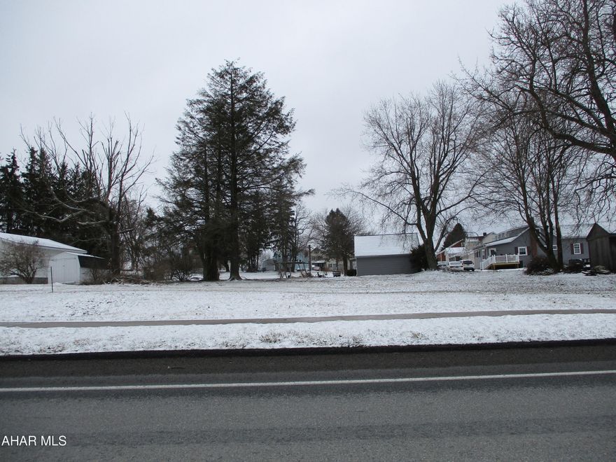 Nice lot right on 219 in Carrolltown. Flat and no zoning. Public water and sewer. Taps are already installed. Water and sewer $67/month on minimum usage. Perfect place for a home, garage or other endeavor. Access to the lot is in the rear