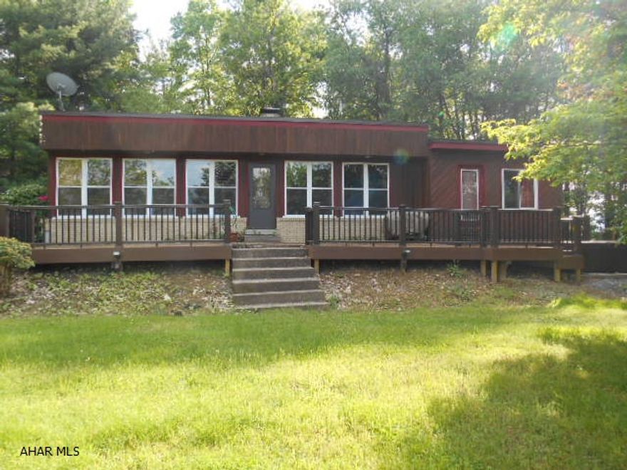 Unique 3 bedroom, 2 bath cedar sided ranch home on 1.23 acres.  Close to everything, but private setting.  Composite deck with hot tub.  Updated kitchen.