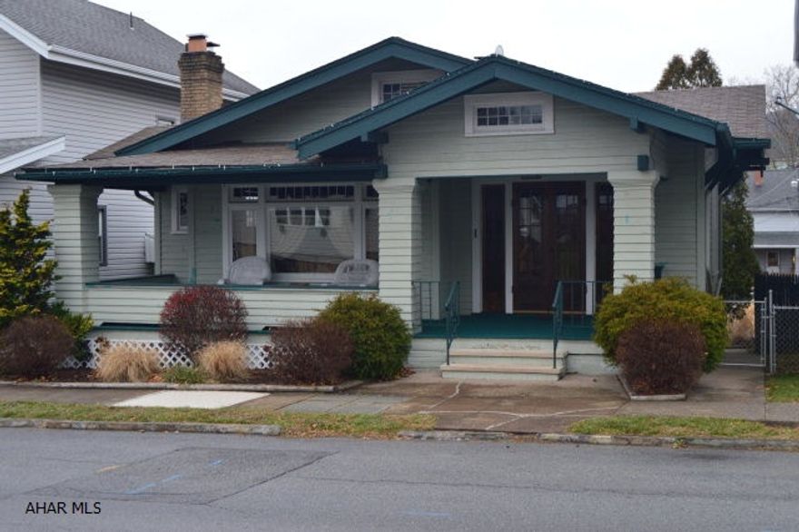 This charming home has so much to offer anyone!  The craftsmanship throughout the entire house is breathtaking.  From the hardwood floors, to the tray ceilings, custom bookcases and solid wood doors - this house has so much character.  A newer fridge and stove are included.  The home is well insulated (blown insulation) and there are 2 wood fireplaces.  Parking is right in front of the home and the fenced in backyard is very spacious.