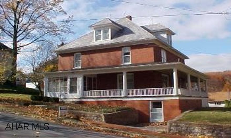 All oak woodwork, pocket doors, finished attic.  Great in town three story brick home with four bedrooms, one and a half baths, extra lot with two car garage. Plenty of room in this large three story, four bedroom, one and a half bath home. Wonderful Oak woodwork, pocket doors, finished attic. So much room!