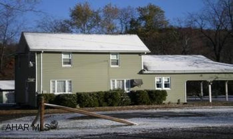 Partially remodeled two story - large patio/carport.