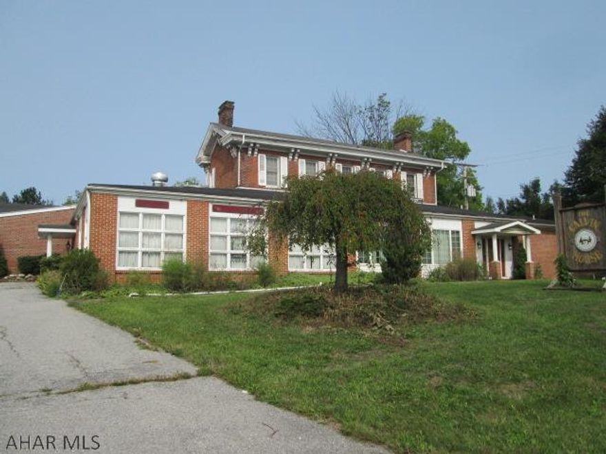 This 10,000 sq ft building sits on 1.86 acres. Previous use was restaurant/banquet hall but moving forward the site offers many possibilities. 2nd floor features large apartment living and is currently in use. The site is only 1/4 mile from Walmart/Sam's Club. Parking for 40+ vehicles and over 10,000 sq ft building offers many excellent possibillities for church, warehouse or car sales. Many options and now priced to sell!