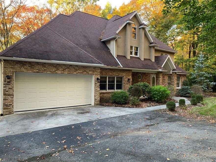 FALL in LOVE with this beautiful two story home situated on a cul-de-sac in the Martinsburg area! Come see for yourself this 4 bedroom 2.5 bath home with a desirable floor plan and breathtaking outside views!The inviting foyer has ceramic tile floor which leads you to the formal living room and dining room.Granite counter tops, eat in kitchen and plenty of counter space for your cooking needs.Enjoy gatherings off the kitchen in the great room leading to the sun room /office. Plenty of sunlight enters through the  windows, bay window and patio doors taking you to your private outdoor deck and lawn. Second level includes 3 bedrooms with walk-in closets with adjacent full bath. With the master bedroom to the back of the house including master bath with jetted tub and shower. A MUST SEE!!!!!