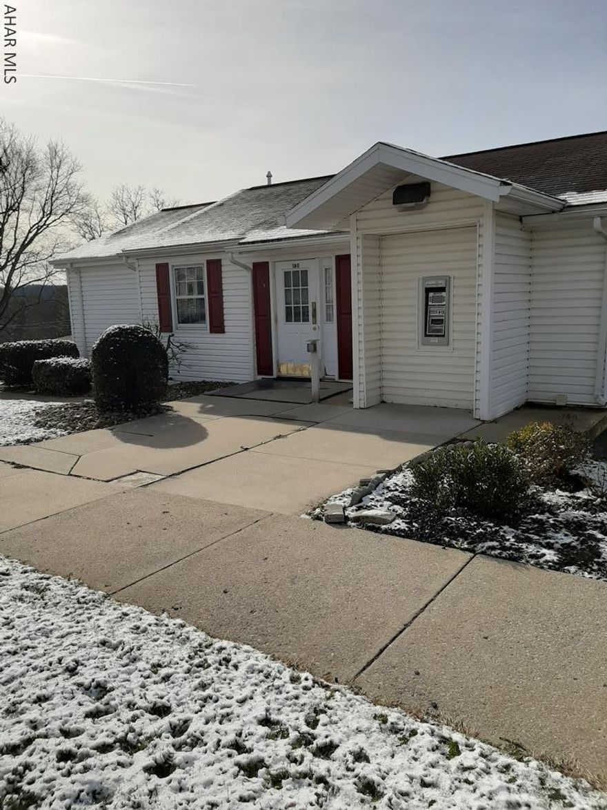 Come check out the perfect office space near St. Francis College. There is a main office area with 2 additional private offices. Vault is still existing in this remodeled bank with ATM. Storage closets in main area plus down the hall is a kitchenette/breakroom with access to outside or to the basement. The basement offers more storage with separate entrance. This could easily be turned into a rental space for additional income. Plenty of paved off street parking, security system, handicap accessible, internet/Wi-Fi, nice clean space for your new or existing business. Highly sought location! Call for showing today!!