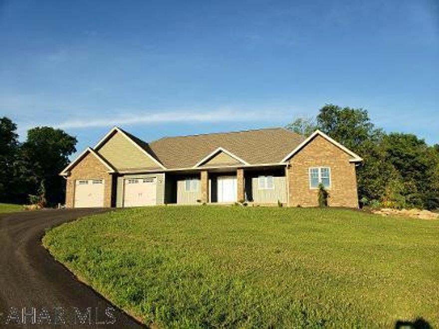 STUNNING BRAND NEW STONE & VINYL HOME across from Iron Masters Golf Course on 2.86 Acres!  Great open floor plan with cathedral ceilings, fireplace, quartz counters, master bedroom ensuite has spacious walkin closet (approx 10x11 feet!), vinyl tile in baths & laundry, 3 bedrooms, 3 baths + drains already installed in basement for 2 more potential baths.  Great view of sunsets from front porch & nice stamped concrete patio in back, professionally landscaped.  J-544