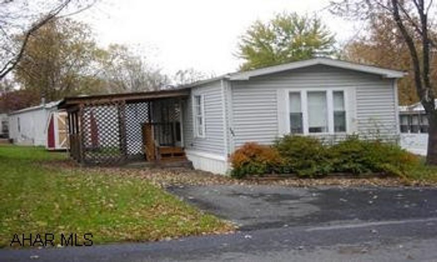 Well maintained 1988 70' x 14' single wide located in Friendship Village offers newer carpeting, flooring, appliances, shed doors, exterior steps and rail; also offers a 20' x 10' covered patio PLUS a storage shed!  Walk to all pool, fishing, Friendship Village conveniences.  Lot rental is $165/month and purchase is subject to Friendship Village approval/acceptance. FULL oil tank too!! --Subject to Probate Court--