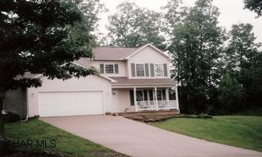 Shuttered 2-Story vinyl sided home in quiet neighborhood. Near schools Large yard and woodland views.