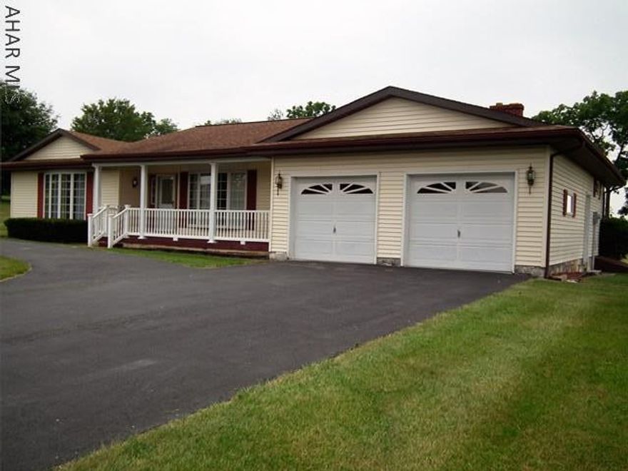 Beautiful View! This 3 bedroom home sits on mostly flat 1.18 acre, farm field back drop, large rooms with natural light, 2 bathrooms (master is shower), semi circle drive, great curb appeal, additional garage in back.  Great Area! Taxes are to be confirmed.