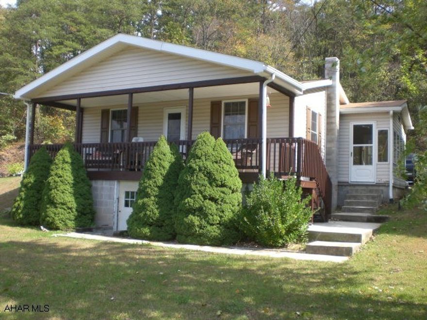 Well maintained one-story home w/ vinyl siding, thermo pane windows, and shingle roof.  The interior offers a living room, small office, kitchen w/ eat-in area, two bedrooms and a full bathroom.  Oil forced air heat, partially finished basement, macadam driveway, enclosed sun porch and front covered porch.  Nice view of the surrounding countryside, private setting, close to Yellow Creek and the Hopewell Sportsman Association.  A really nice home and setting w/ all appliances included.