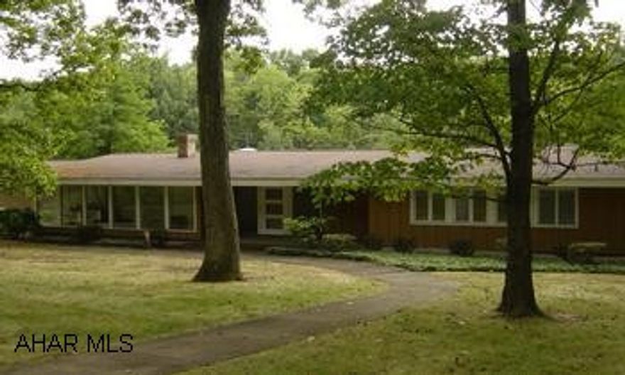 Lg Kitchen w/vaulted ceilings, sky light & Pantry closets.  Main level Laundry, Large family room with fireplace, wet bar & built in cabinets.  Covered Patio, Lg master bdr w/walkin closet & Bath.  Lg. Nicely landscaped lot.  Freshly painted interior.  TAX APPEAL was approved, and new tax amount is estimated to be $3,048.00 yr.