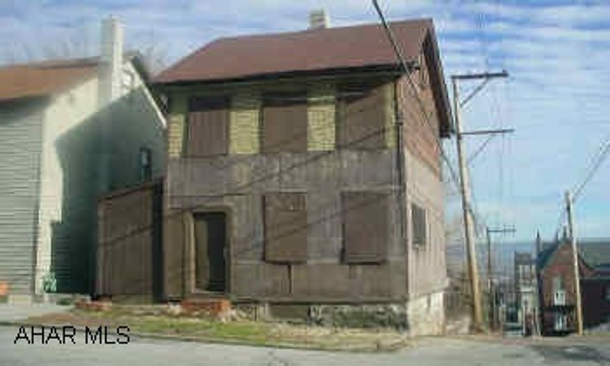 A real handyman special!  Across the street from Gospel Hill-great view of the city! Property sold "as is".  Assume that mechanics are non-functional.