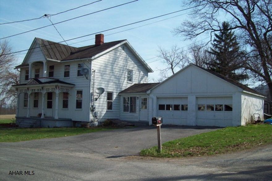 Enjoy small town living in this 2-story Victorian home with 4-bedrooms, 1.5 baths and first floor laundry.  Other features include an enclosed breezeway, attached 2-car garage, level lot and a small decorative pond.