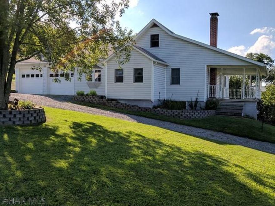 Huge open rooms for entertaining and enough parking to accommodate an RV! Beautiful patio space within walking distance to the goldfish pond and waterfall that spans the side of the house. Tons of perennial flowers adorn the landscape of this 5 bedroom home!  Multiple heating options, oversized 2 car garage, garden space, updated kitchen, full basement. Check out this spacious move-in ready home minutes from Downtown Bedford and I-99.