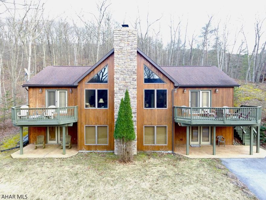 Beautiful custom built home with a private setting located minutes away from Shy Beaver Boat Launch at Raystown Lake. Home offers three bedrooms and three bathrooms with an open first floor plan with a stone fireplace surrounded by large windows and a vaulted ceiling. The first floor also offers a dining area, kitchen, three bedrooms including a master bedroom with an ensuite and private deck, additional bathroom, and laundry room. Located off of the living room you will find a spiral staircase leading down to the finished basement where you will find two bonus rooms that could be used as bedrooms, 3/4 bathroom, large recreational area, and a mechanical/storage room.