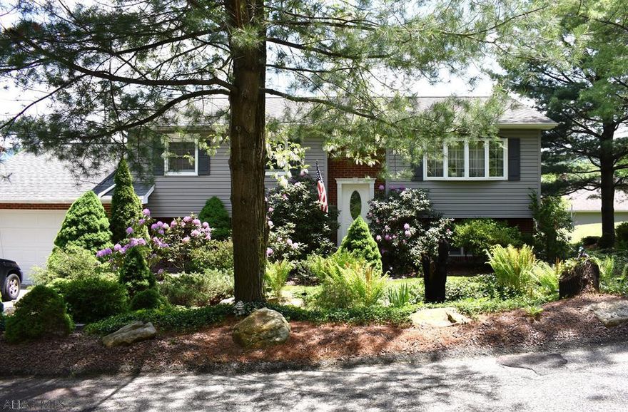 Located in a quiet neighborhood, this property comes fully loaded!  This home features an over-sized attached garage with a built in wall heater for the cooler months, an inviting fully fenced in above ground pool for the warmer months, as well as a covered hot tub good for dips all year long!  The fully finished basement is great for entertaining. This includes a built in bar fully equipped with refrigerator, tap system, storage room and fireplace.  You cannot help but to notice the beautifully finished hardwood floor throughout the living room and spans down the hall.  There are simply too many features to mention, you must see it for yourself!