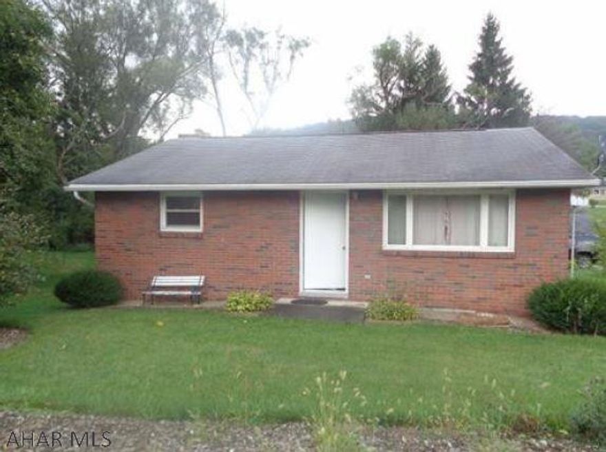 All brick home and brick one car garage.  Needs TLC but nice location on corner lot.