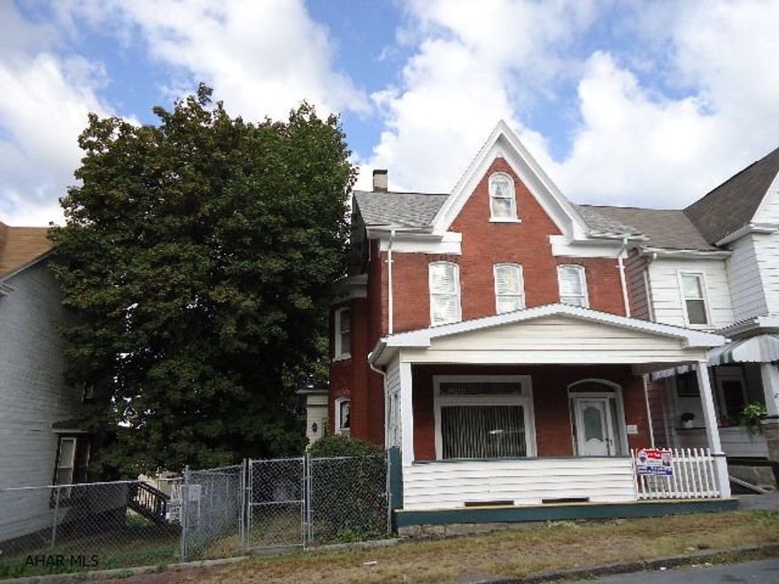 4 bedroom brick with finished attic, fenced yard, large rooms. Washer, dryer hook-up in kitchen. Great starter - nice woodwork