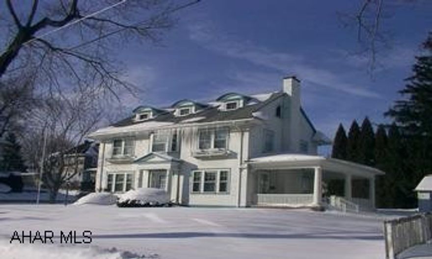 Fabulous 5 bedroom 3 1/2 bath home on giant corner lot, 4000 square feet.  Completely renovated.  Beautiful hardwood floors and built-ins throughout.  Master bedroom suite with jacuzzi tub, grand foyer with two staircases.  Pocket doors, river rock fireplace, ceramic tile, first floor laundry, french doors to lovely side porches.  One of a kind home...a must see!