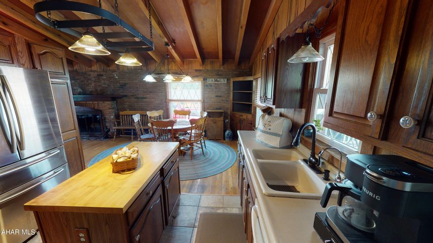 Beautiful Split level home in the Hollidaysburg School District.  This well maintained  property on 1.28 acres features 3 bedrooms and 2 full baths. A large kitchen with an island ,dining room and a living room with a wood fire place. An additional family room with a wet bar. A spacious landscaped back yard with a water fall and a large pool with a pool house and a hot tub.  A large patio perfect for entertaining that includes a firepit, brick pizza oven and covered dining area.  2 car detached garage with plenty of second story storage.  This is a must see. Schedule your tour.