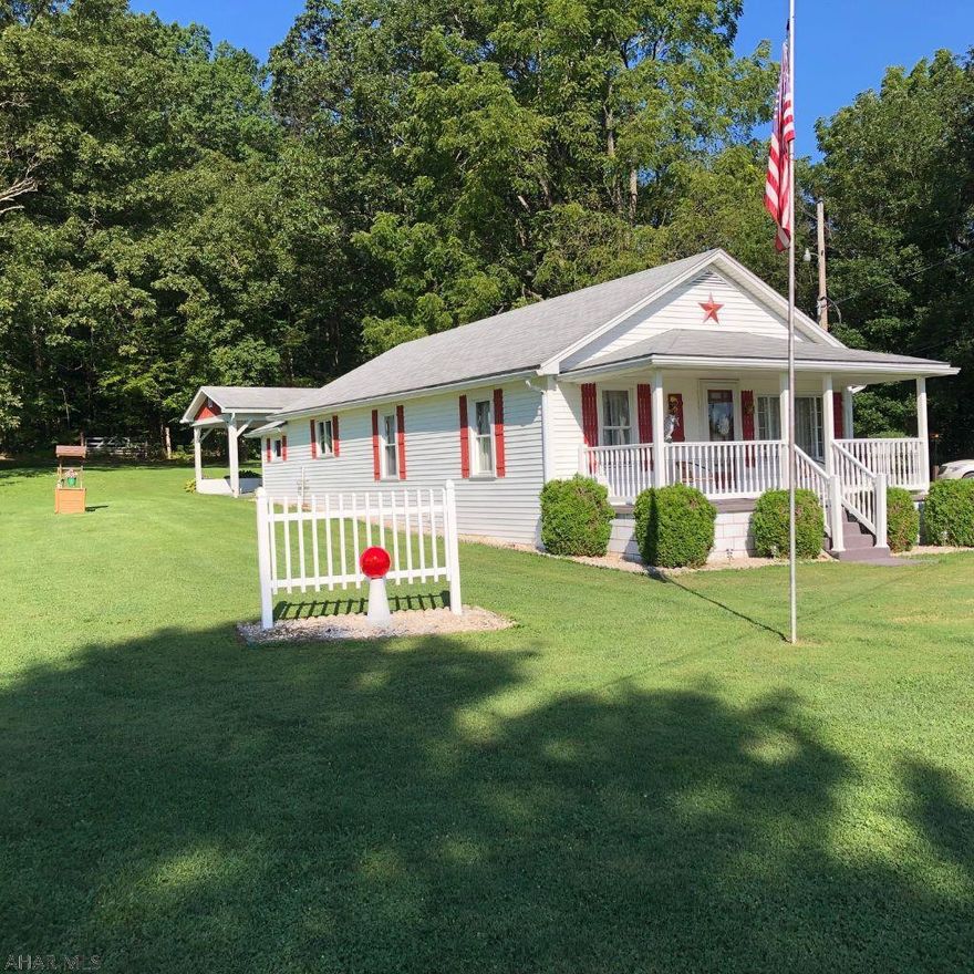 Sweet bungalow, well maintained. Move in ready! Original hardwood floors under living room carpet. Forced air oil heat and central air. 2.25+ flat acres that are beautifully manicured. Inviting front porch with vinyl railing. Great location with a great carport to boot!