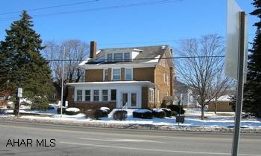 Very well cared for impressive 3 bedroom brick home on large corner lot features large rooms, gas hot water heat, mostly replacement windows, and much more.  Zoned for business.