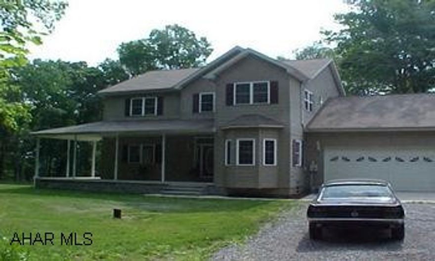 Solid Oak 6 Panel Doors throughout- some areas need finished.  Tremendous location!  Peninsula- see through fireplace.  Wrap around porch.   $1,000 bonus to selling agent if sold before  6-30-08. This house is ready for the tech savvy!  Many Electronic amenities.  All appliances included.  Alarm system- 2 full & 2 half baths.  Beautiful cherry kitchen with wine rack.  Fans- most have remotes.  Cable hook ups for outside & speakers surround sound system.  $ 1,000 bonus to selling agent if sold before 6-30-08.