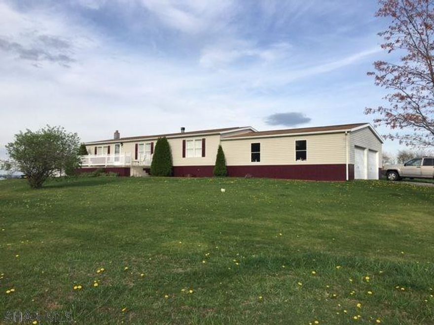 3 bedroom, 2 full bath doublewide home on full 28'x60' foundation with large 28'x32' 2 car garage. Country setting on 1.5 acres with beautiful views. Includes hot tub and high end pool table. Drive is shared with neighboring farmer only to access fields behind home. Well maintained and move-in ready!