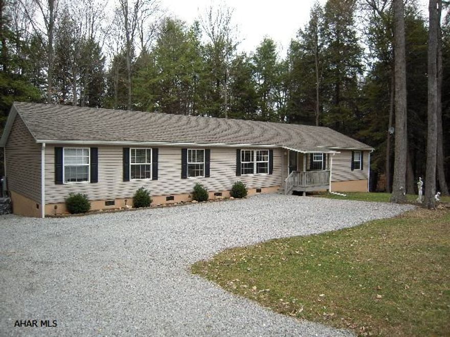 Like new 2000 square foot doublewide on full foundation. Large eat-in kitchen with oak cabinets and center island. Wood burning fireplace in the family room. Central air. Enjoy your view of the woods off of the 42 foot rear deck. Located in Glendale Yearound which has its own heated pool, tennis and basketball courts. Close to hunting and fishing. Near Rock Run Recreation Area. Would make a fantastic yearound home or a great vacation home.