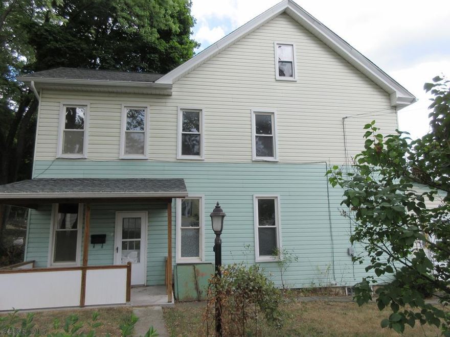 Nicer 2 Story Vinyl Fairview Home. Quiet neighborhood, 1 car detached garage and large yard. Large eat-in kitchen, formal dining room, and large living room. 3 bedrooms, 2 bathrooms. Needs some work but could be nice. AS-IS sale. Seller will make no repairs.