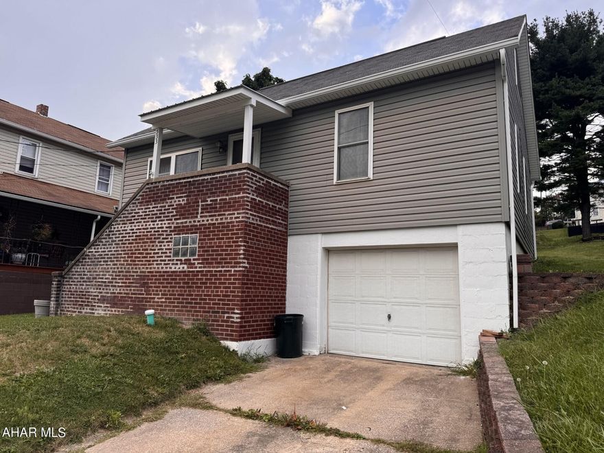 3-4 BR vinyl sided home with 1 car integral garage on 48' x 150' lot.  Newer oil, hot water furnace.  Freshly painted.  200 amp electric service.  26' x 30' pole building with 2 garage doors.  Interior could be finished as it is stubbed for electric & water.