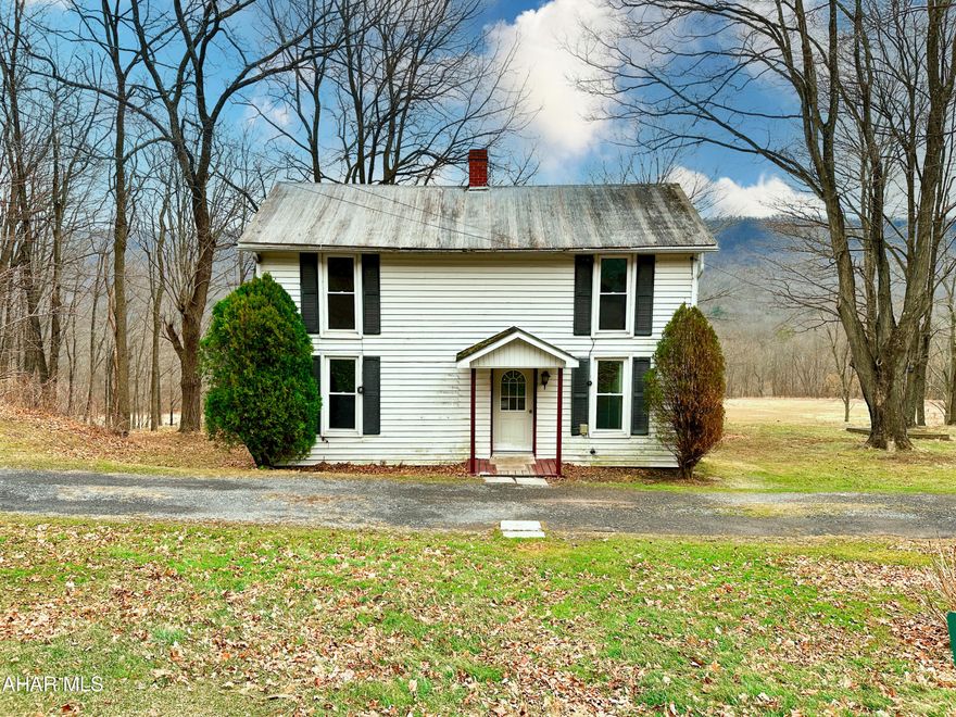 Welcome to your new home! This 2-bedroom, 1-bathroom house offers versatile living space with the added bonus of an additional room on the first floor that can be used as another bedroom, all with brand new carpet! Nestled on just over an acre of land with beautiful country views from your rear balcony, this property provides the perfect blend of privacy and accessibility. Located near the historic Bedford Springs, you'll enjoy the peaceful surroundings while still being close to all the conveniences of in-town living. Don't miss out on the opportunity to own this home. Schedule a showing today!