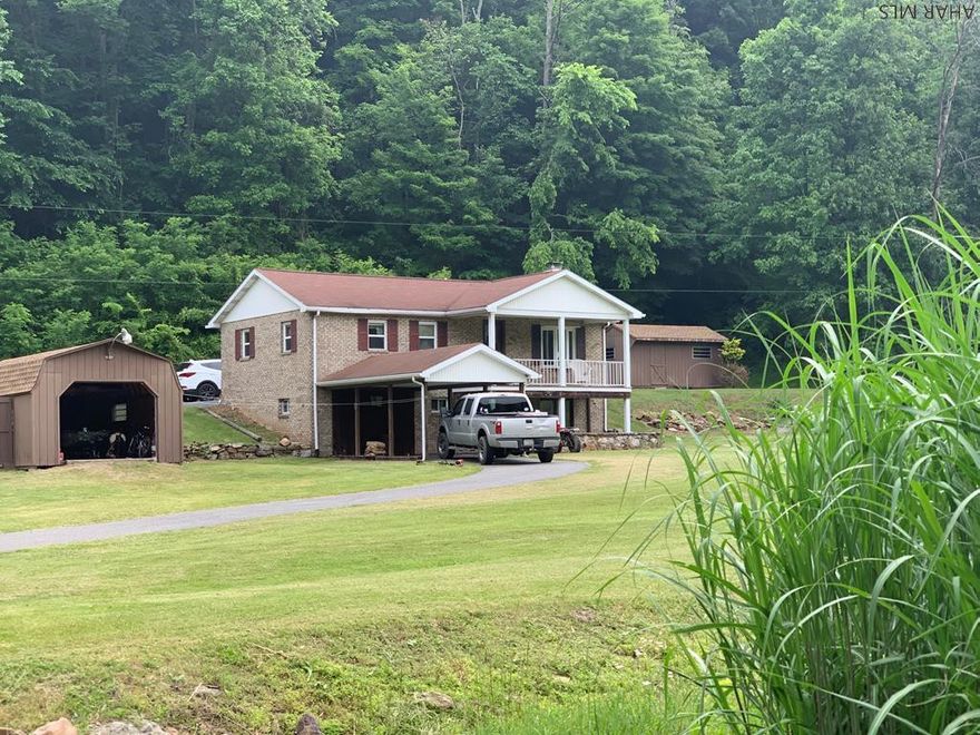 Enjoy the peace and solitude one feels when enjoying the comforts of this privately located 5+ acre property.  A babbling stream provides wonderful sounds while enjoying the views from the lovely covered porch that overlooks the property.  Hunters will delight in the game lands that are within minutes and historic Bedford & Omni Bedford Springs are also located within a short distance.  Immaculately maintained and move in ready!