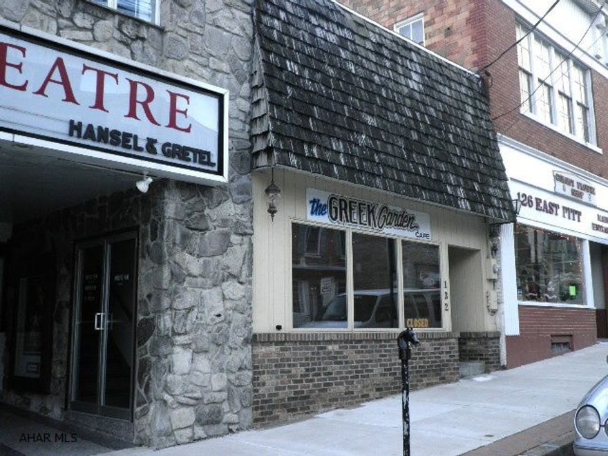 Former Greek Garden Cafe. Request list of items to be included. 200 AMP Elect. Service. Natural Gas for Cooking, Ansul Fire system- kitchen, Central air, Part slab/part crwl foundation, Elect. water heater.  The PENNY SCALES is NOT included; and, some personal property/items will NOT be included.  NOTE:  STEPS WHICH LEAD UP TO KITCHEN LOCATED IN BACK PART OF BLDG. - TOP STEP IS LOOSE - PLEASE BE CAREFUL.